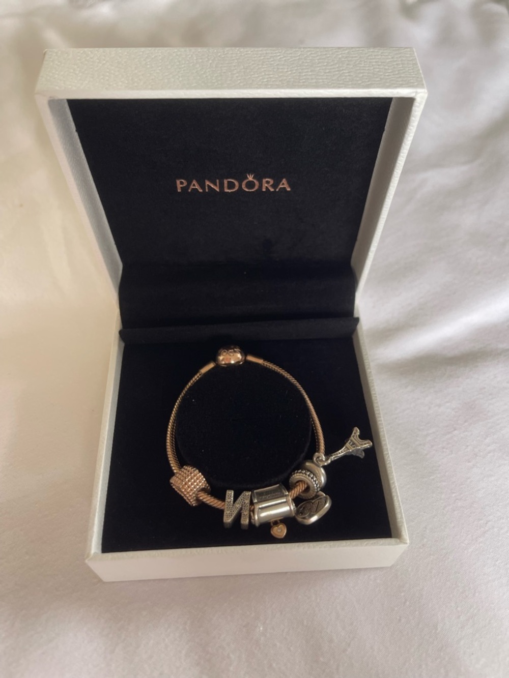 Pandora rose gold bracelet and charms